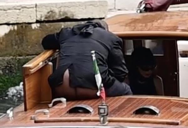 Kanye West exposing bum on a boat