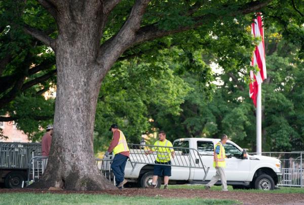 Workers gather barricades at Polk Place at the University of North Carolina 