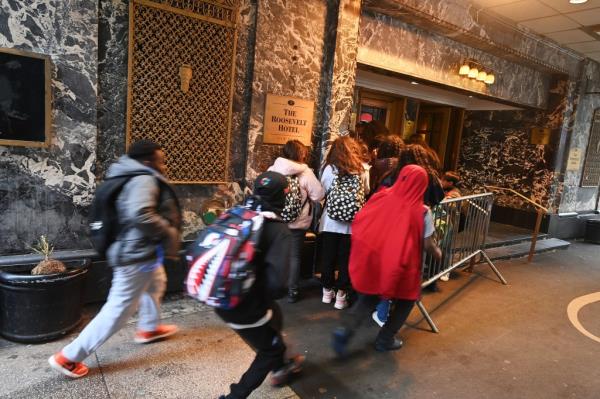 Migrants arriving at the Roosevelt Hotel