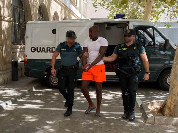 Detained French rape suspects arriving at Court in Palma yesterday.