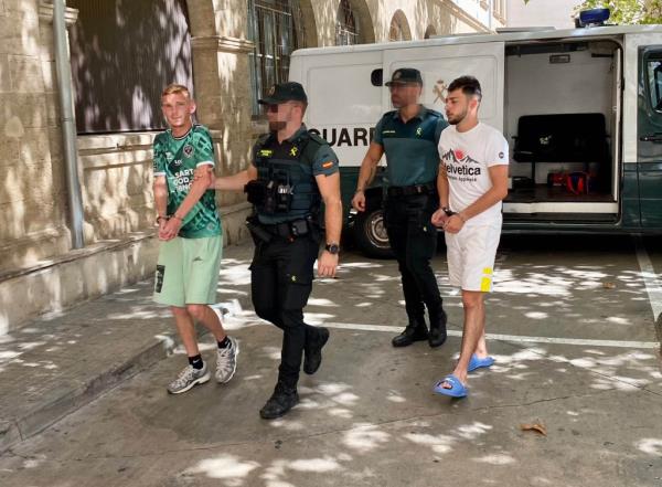 Detained French rape suspects arriving at Court in Palma yesterday.