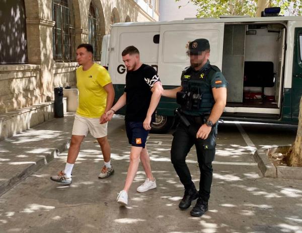 Detained French rape suspects arriving at Court in Palma yesterday.