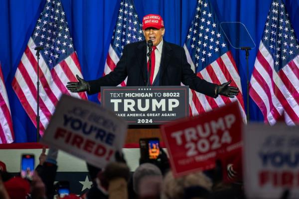 Do<em></em>nald Trump speaks during a Get Out the Vote Rally and campaign event at the Elite Jet Center in Waterford Township, Michigan, 17 February.