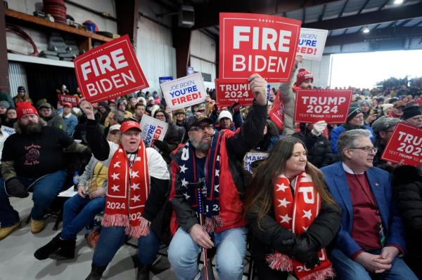 Supporters hold signs before Republican presidential candidate former President Do<em></em>nald Trump attends a campaign rally in Waterford Township, Mich., Saturday, Feb. 17.