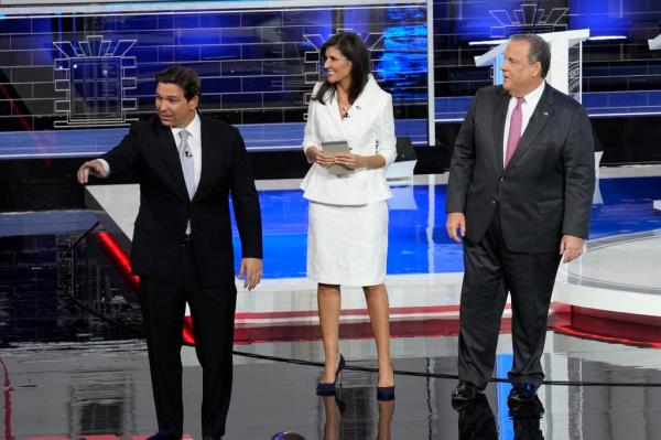 Republican presidential candidates Florida Gov. Ron DeSantis, former U.N. Ambassador Nikki Haley and former New Jersey Gov. Chris Christie walk on stage after a Republican presidential primary debate hosted by NBC News.