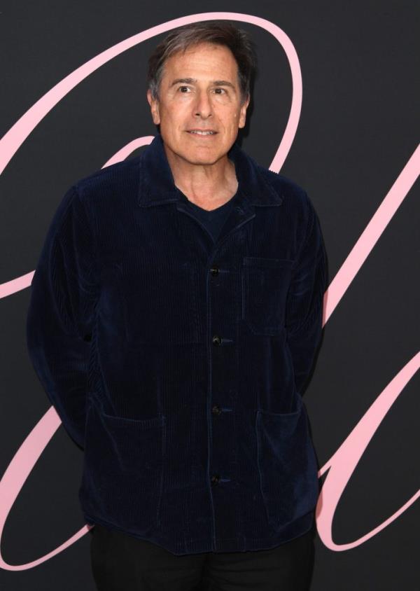 David O. Russell standing against a black background at the premiere of 'Lola' in Los Angeles, California