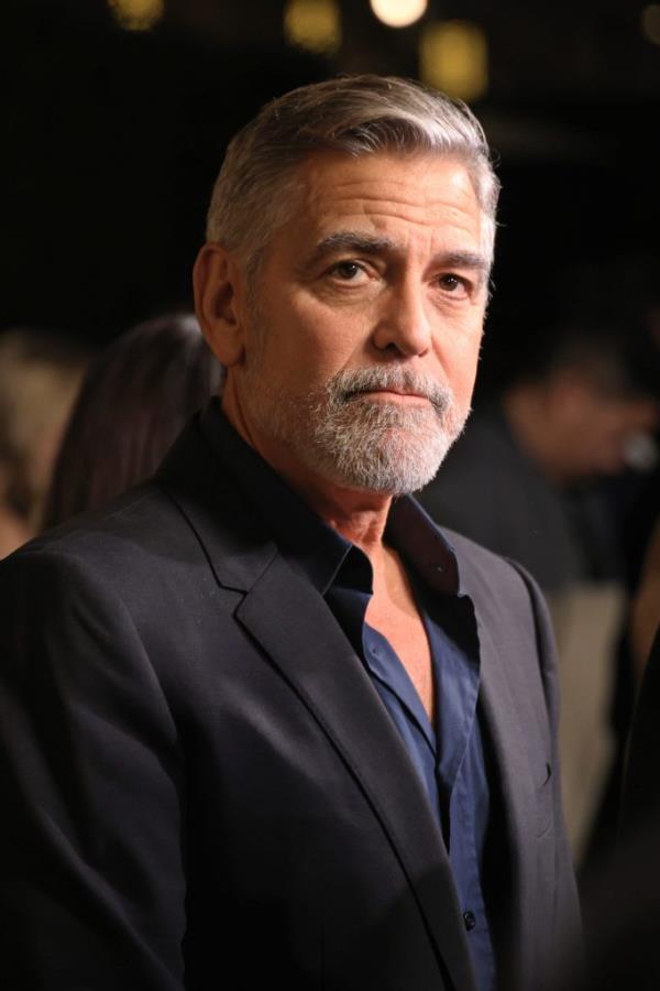 George Clooney, with a beard and mustache, wearing a suit at the Los Angeles premiere of Amazon MGM Studios' 