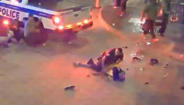 An Orlando Police Officer tackles Edgar after spotting him shooting into the crowd.