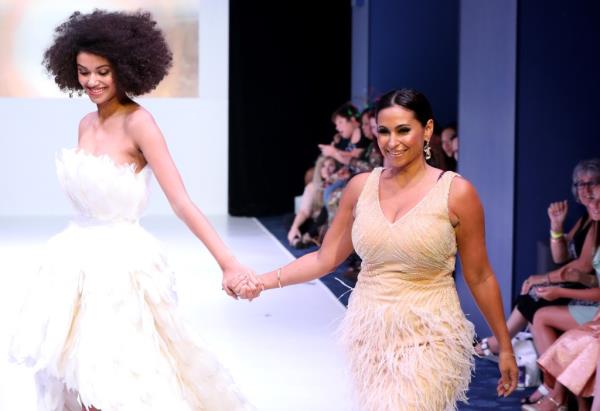 Laylah Rose designer Laylah Loiczly and a model walking on the runway during New York Fashion Week