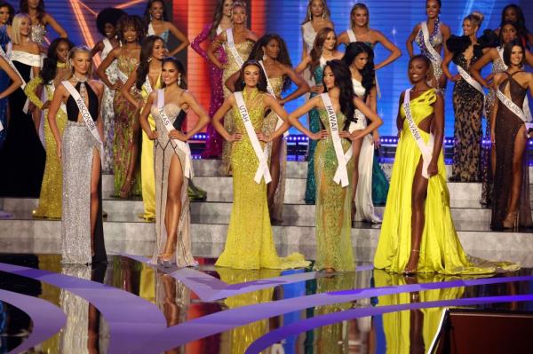 Miss Utah USA 2023, Noelia Voigt, being crowned as Miss USA 2023 at the 72nd Miss USA Pageant in Reno, Nevada, with Cinthya Carmona, Huda Kattan, Ariadne Artiles and other women present in elegant dresses