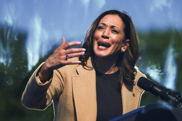 Democratic presidential nominee and U.S. Vice President Kamala Harris speaks behind a protective glass during a campaign stop in North Hampton, New Hampshire