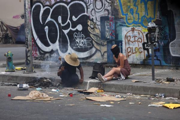 Homeless people in Skid Row. Los Angeles County spends millions on resources for homeless people, some of which goes towards free crack pipes.