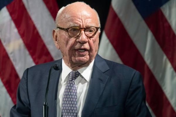 FILE - Rupert Murdoch introduces Secretary of State Mike Pompeo during the Herman Kahn Award Gala on Oct. 30, 2019, in New York. The judge presiding over a voting machine company?s defamation lawsuit against Fox denied the company?s request Wednesday, April 12, 2023, to hold separate trials ? one for Fox News and another for the network?s parent company. The request by Dominion Voting Systems came a day after its attorneys told the judge that Fox attorneys had withheld critical information a<em></em>bout the role that company founder Rupert Murdoch, who is chairman of Fox. Corp., played at Fox News. (AP Photo/Mary Altaffer, File)