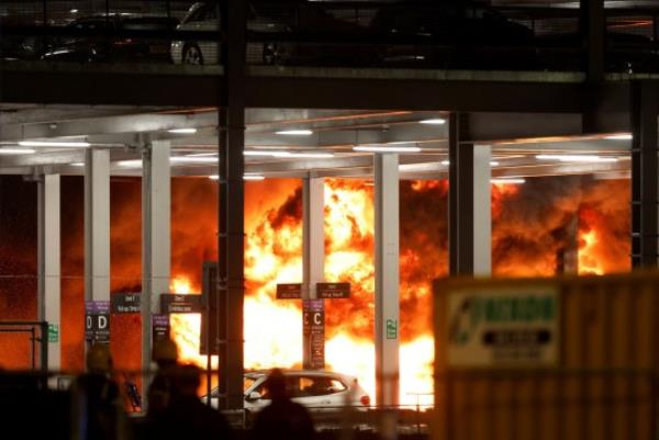 Flames are seen as emergency services respond to a fire in Terminal Car Park 2 at Lo<em></em>ndon Luton airport in Luton, Britain, October 10, 2023. REUTERS/Peter Cziborra