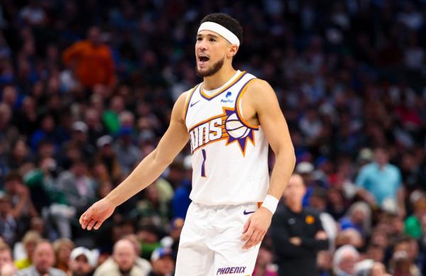 Devin Booker, Phoenix Suns guard, reacting during the second half against Dallas Mavericks at American Airlines Center.