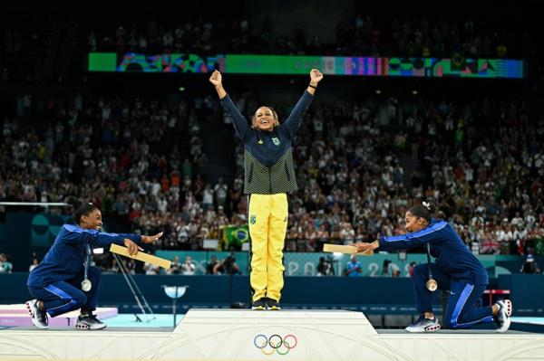 US' Simone Biles (silver), Brazil's Rebeca Andrade (gold) and US' Jordan Chiles (bronze) pose during the podium ceremony for the artistic gymnastics women's floor exercise event of the Paris 2024 Olympic Games at the Bercy Arena in Paris, on August 5, 2024. 