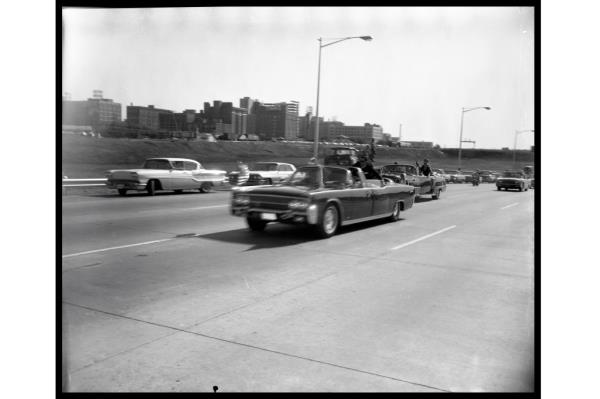 President John F. Kennedy's motorcade speeds down a Dallas freeway to the hospital after he was fatally wounded on Nov. 22, 1963. 