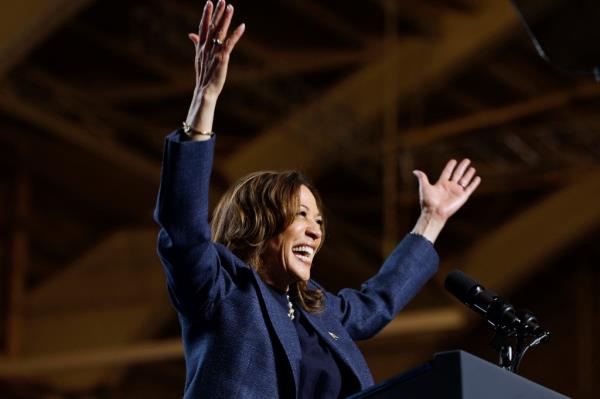 Kamala Harris speaks during a campaign rally at Michigan State University's Jenison Field House in East Lansing, Michigan, on November 3, 2024. 