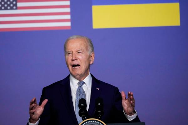 U.S. President Joe Biden delivering a speech at a podium after signing a security agreement with Ukraine's President at the G7 summit in Italy