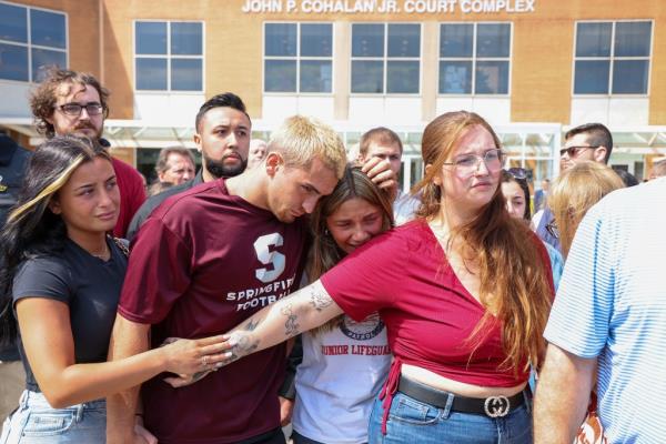 Kenneth Pohlman's children get emotio<em></em>nal outside criminal court in central Islip, NY after the arraignment of Daniel Coppola