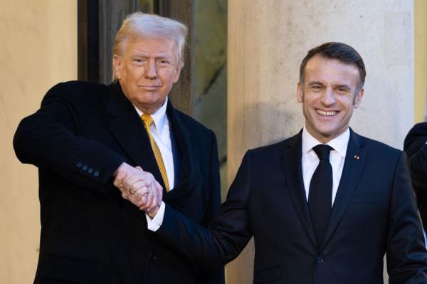 Trump and Macron share a pair of intense handshakes when they met ahead of the Notre Dame re-opening ceremony